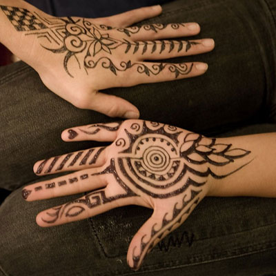 Hands with jagua tattoos