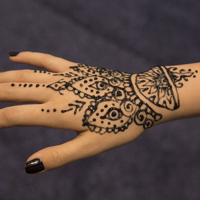 Black jagua tattoo design on hand